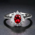 Copper flower-shaped women's ring with zirconium inlay, shown in green, blue, or red electroplated finish.