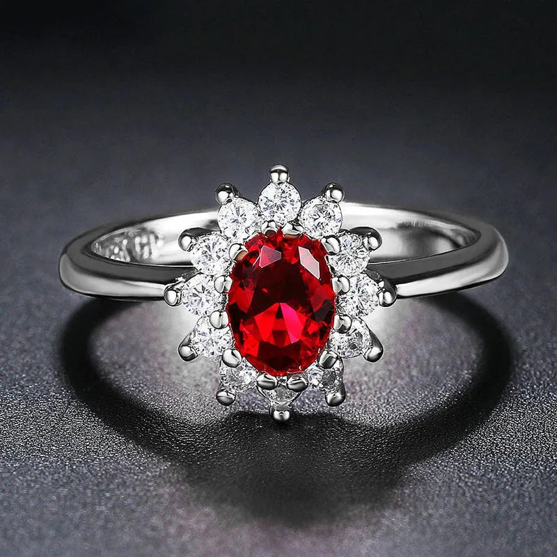 Copper flower-shaped women's ring with zirconium inlay, shown in green, blue, or red electroplated finish.