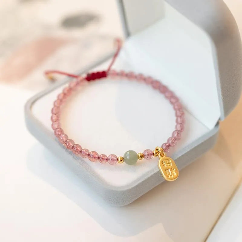 Hand-woven red rope bracelet with strawberry quartz crystals in minimalist national tide style
