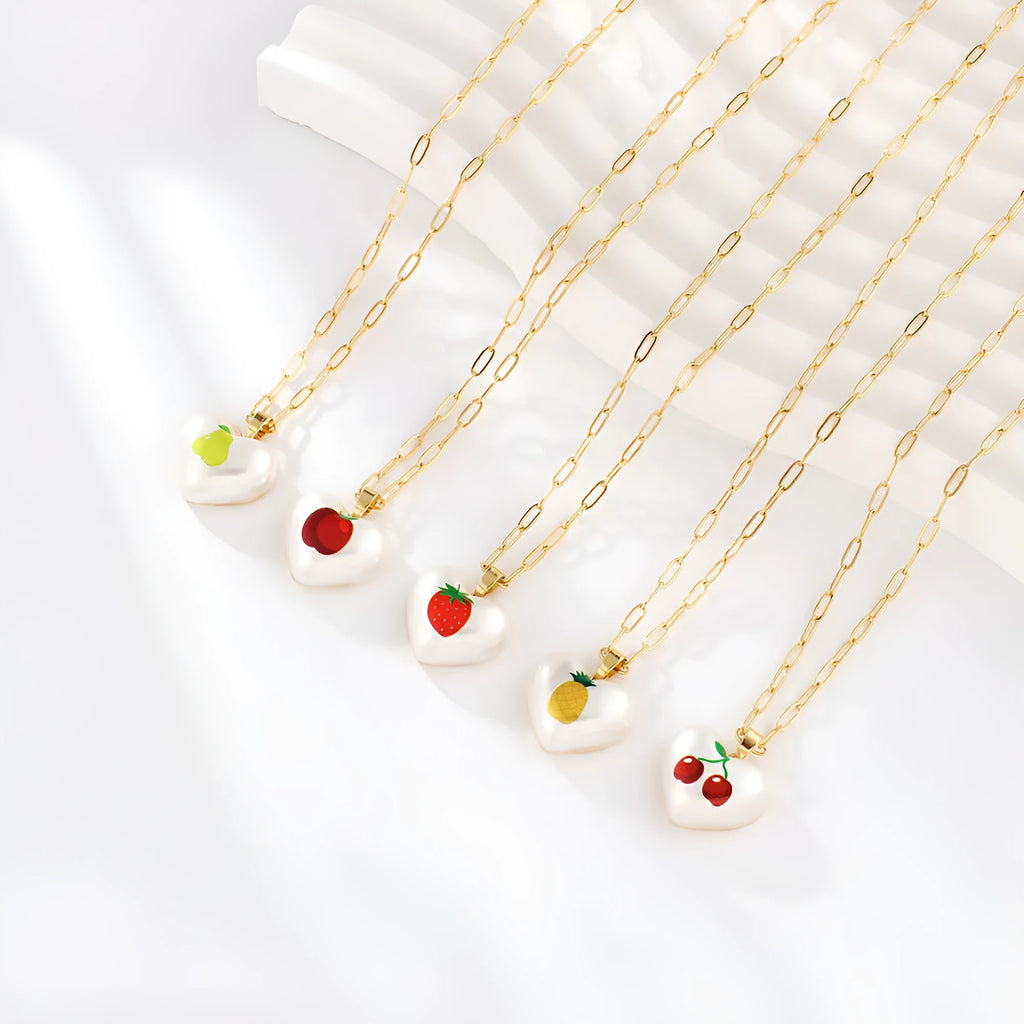 Geometric fruit pendant necklace with adjustable chain showing apple, pineapple, strawberry, cherry and pear designs