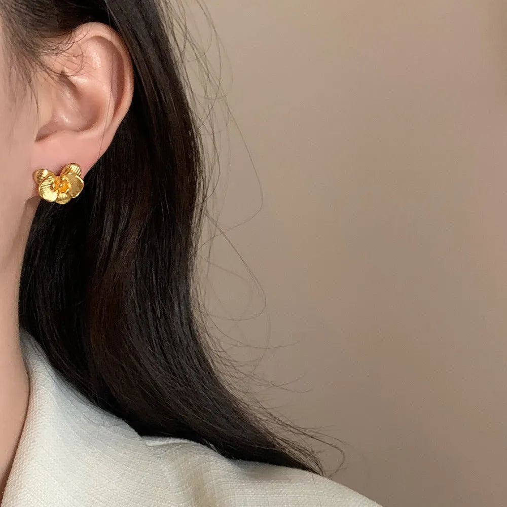 Retro flower earrings for women in gold and silver colours with petal detail
