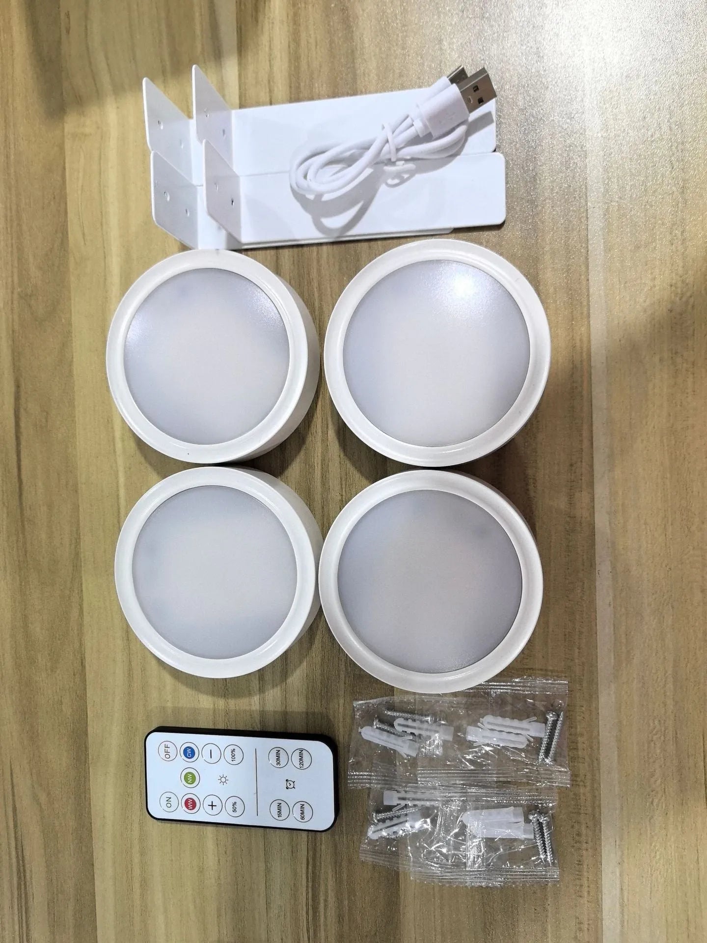 Wireless LED painting lamp with a magnetic mounting belt and remote control in black finish.