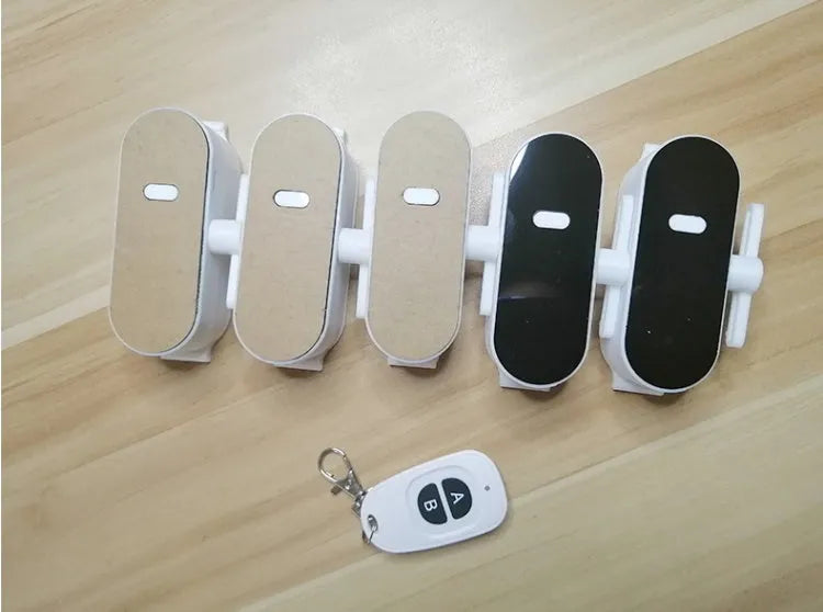 Wireless remote controller switch in elegant white with 6x4cm size and free stickers for paste-on installation