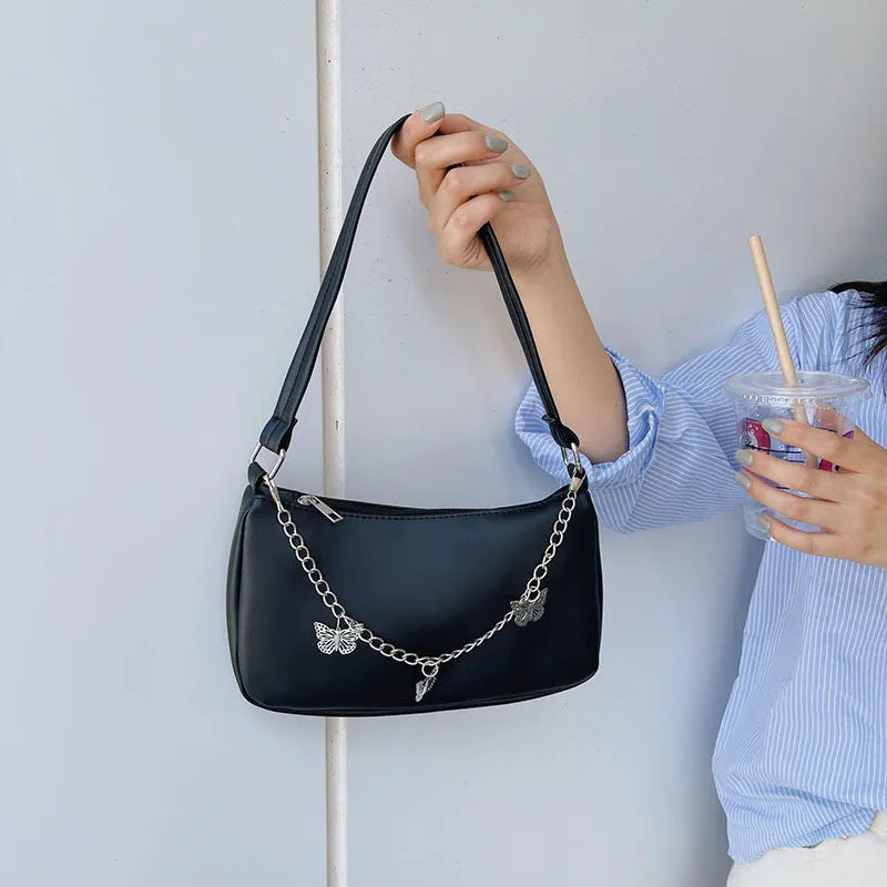 Retro women's chain-strap crossbody bag with butterfly charm in light blue PU leather