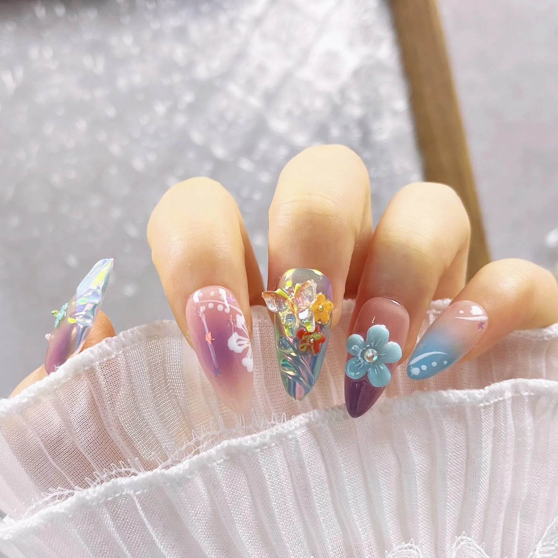 Handmade floral and butterfly nail sculpture charms in four sizes for almond nail art
