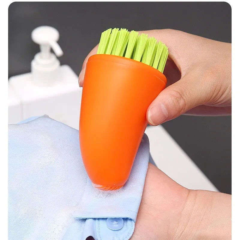 White and orange radish-shaped carrot cleaning brush with nylon bristles for washing root vegetables