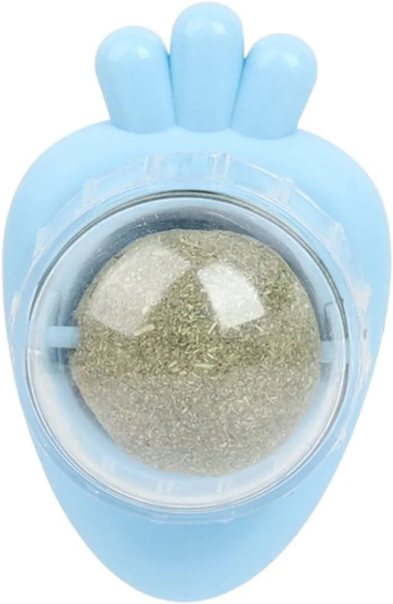 Blue carrot-shaped self-adhesive catnip ball toy for cats on a white wall.