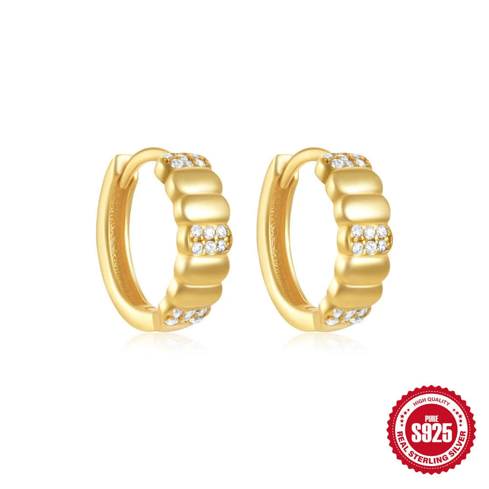 Sterling silver geometric stud earrings with round diamond accents in gold and silver electroplated finishes