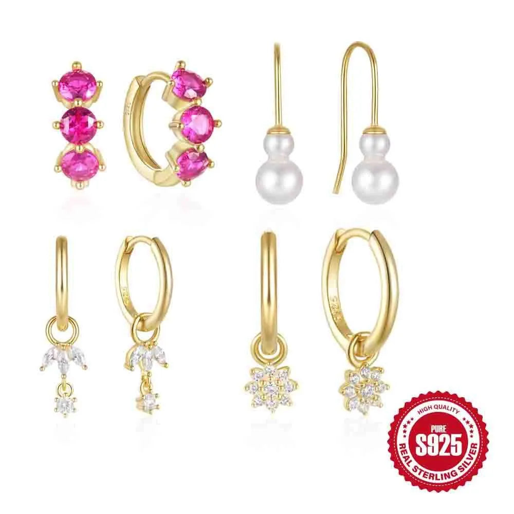 Close-up of geometric sunflower design sterling silver earrings with golden zircon stones.
