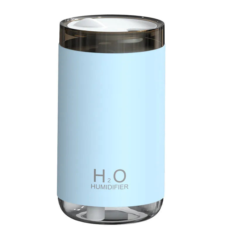 Jellyfish-shaped humidifier emitting smoke ring mist patterns with warm night light glow