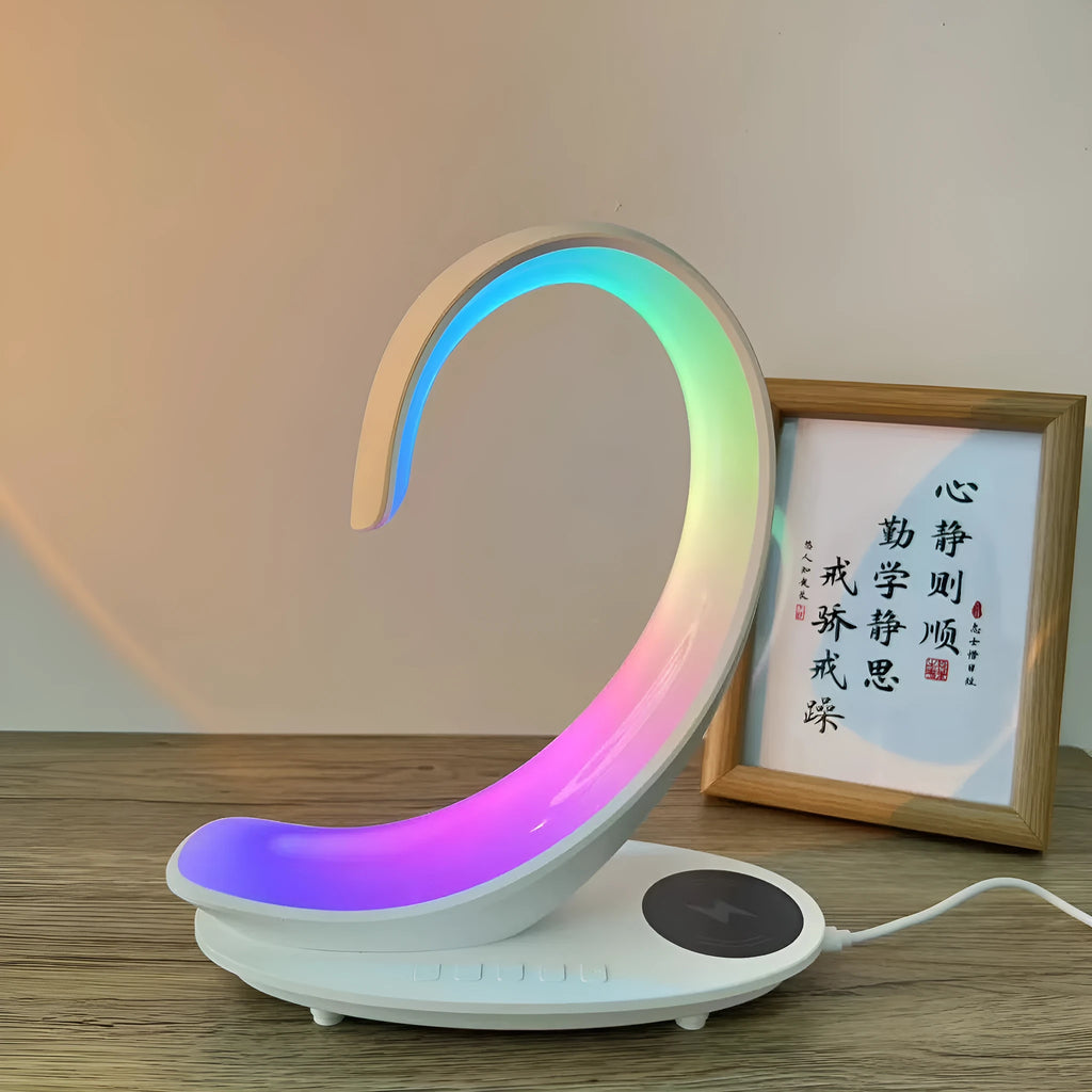 White swan-shaped desktop lamp with wireless charging pad, Bluetooth speaker and colourful atmospheric lighting effects