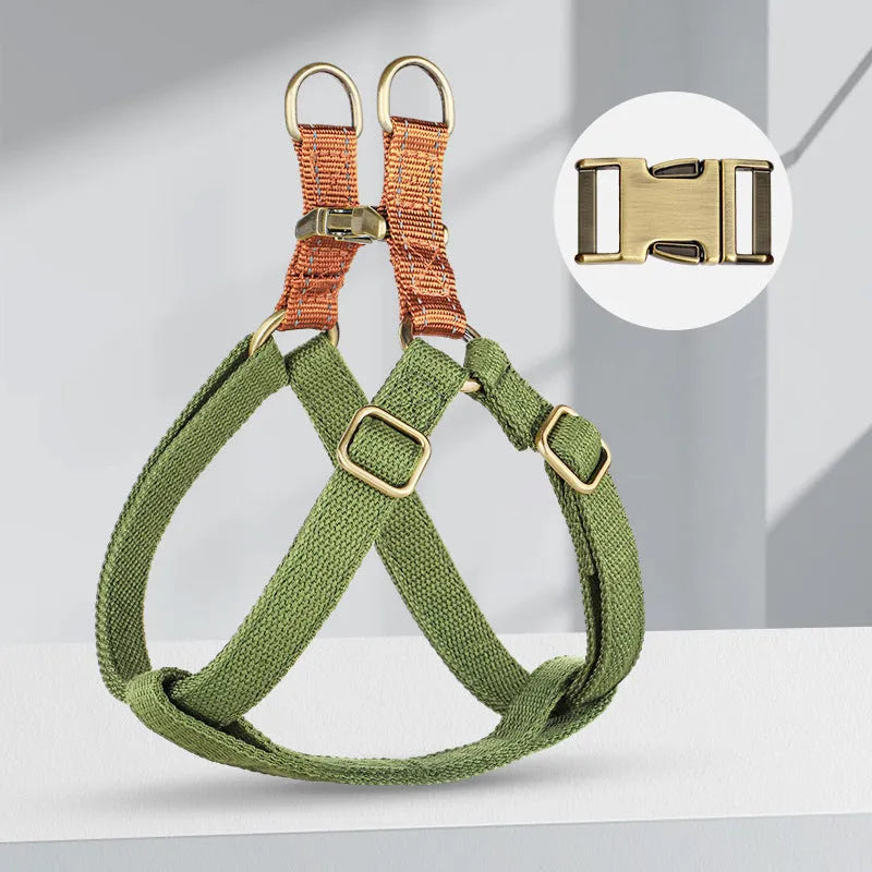 Brown vest-style dog leash harness on small dog showing cotton nylon construction and alloy fastener