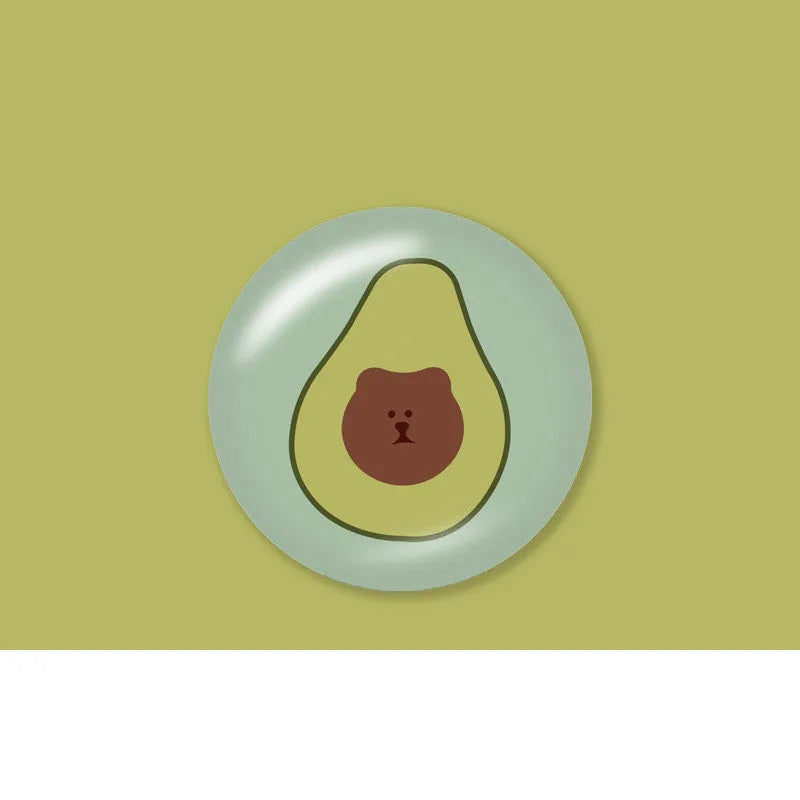 Creative telescopic glue cartoon phone airbag bracket in colour C1 girl design on a desk holding a smartphone