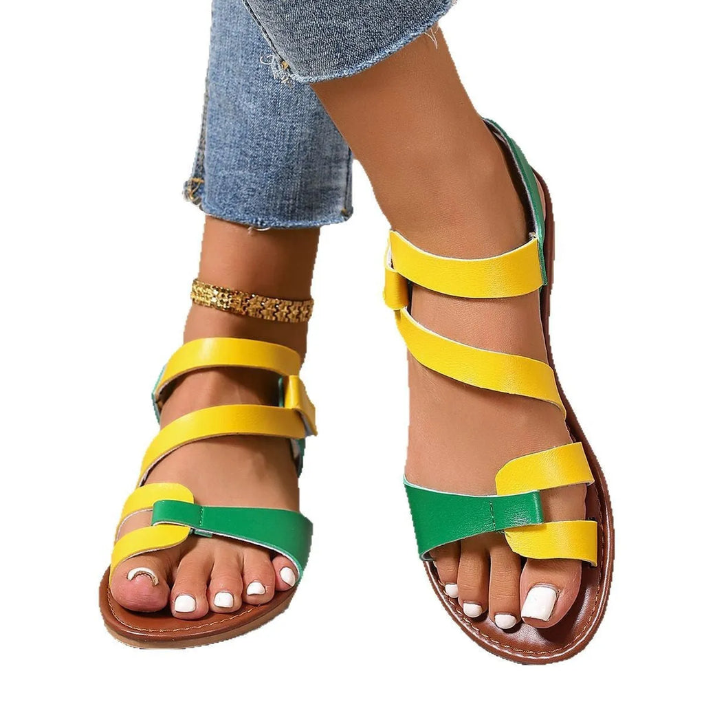 Women's flat sandals with Velcro strap in black, brown, and multicolour on a rubber sole.