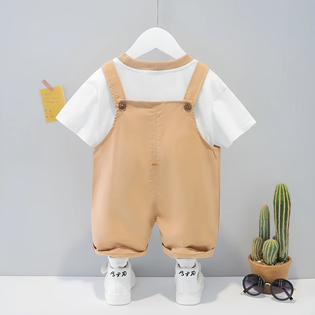 Baby wearing yellow cartoon short-sleeved overalls with adjustable straps