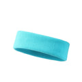 Elastic solid colour sports anti-sweat headband in blue on a white background.