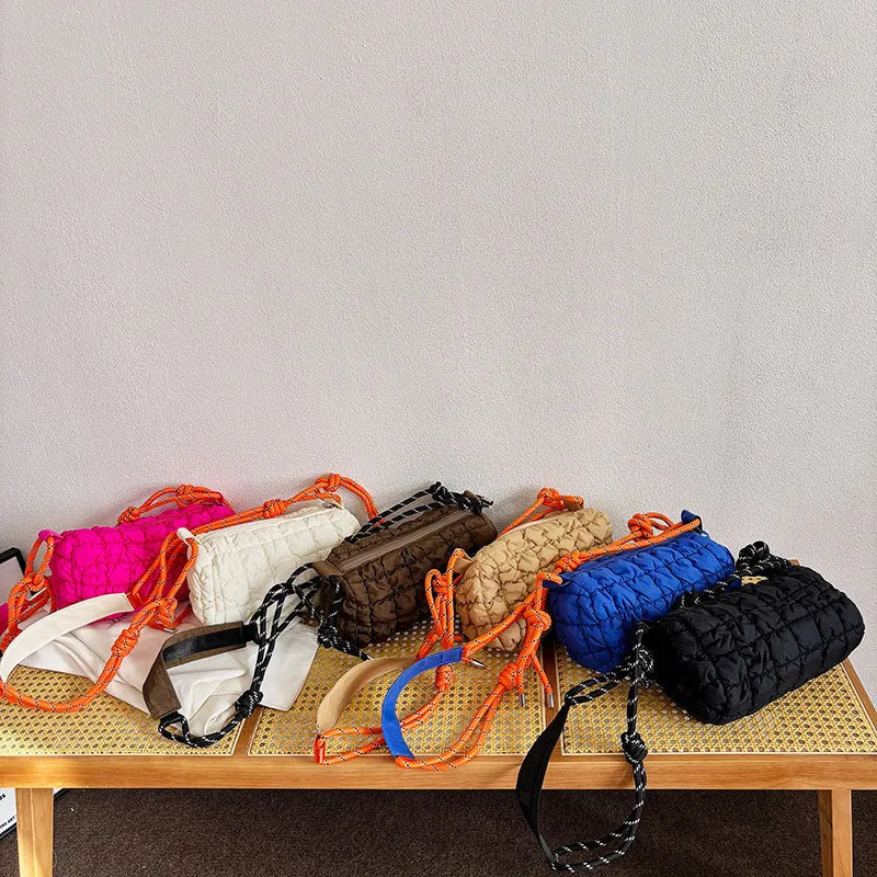 Women's lightweight nylon messenger bag in pillow shape with crossbody strap and rhombus pattern