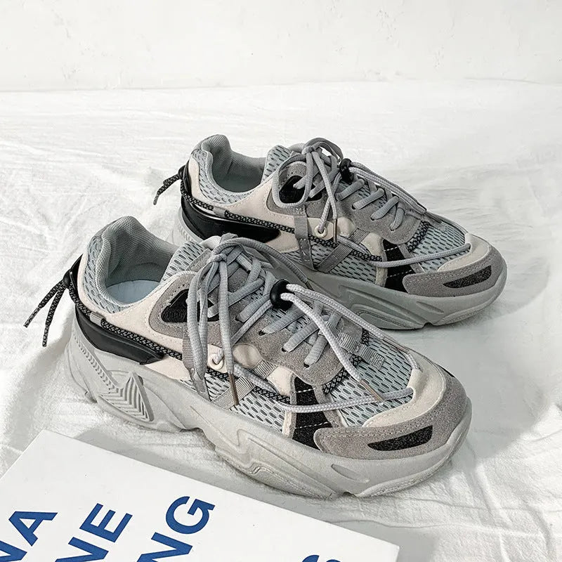 Men's white Korean dad style platform trainers with lace-up front and mesh lining.