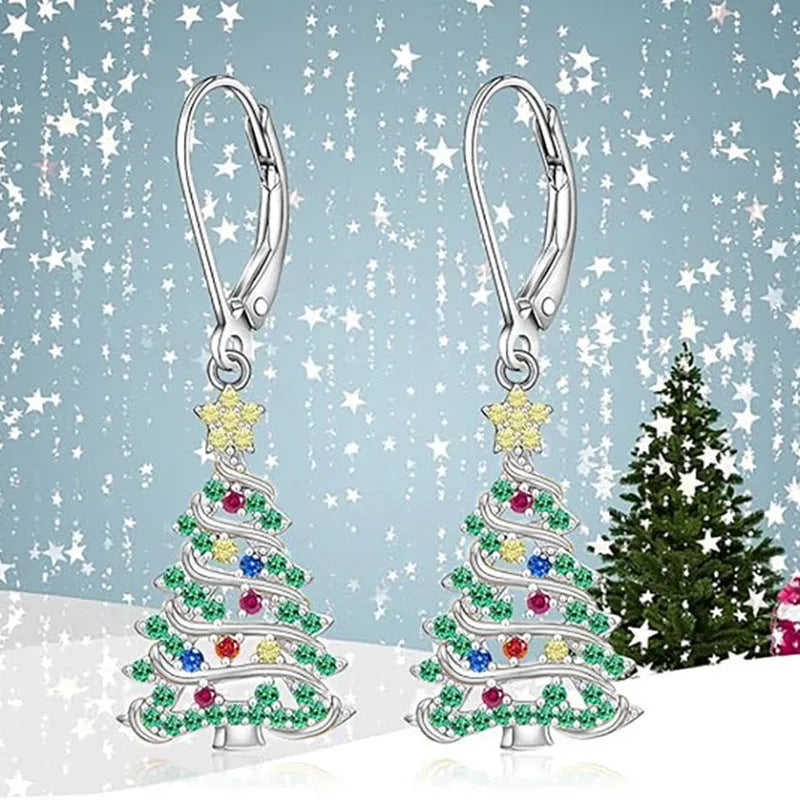 A pair of star-shaped Christmas tree earrings for women in a white gold colour.