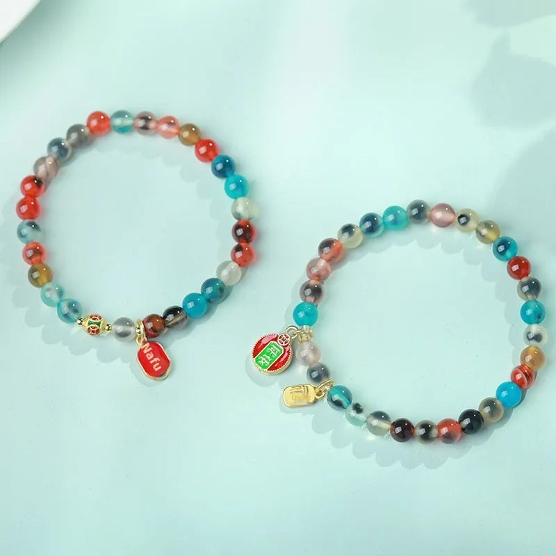 Women's agate bracelet with copper coin snake chain and coloured glaze detailing in geometric bead design