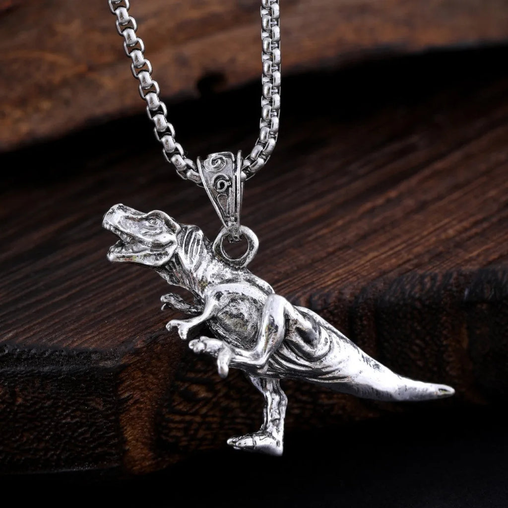 New hip hop style versatile titanium dinosaur pendant in silver tone on a neutral background
