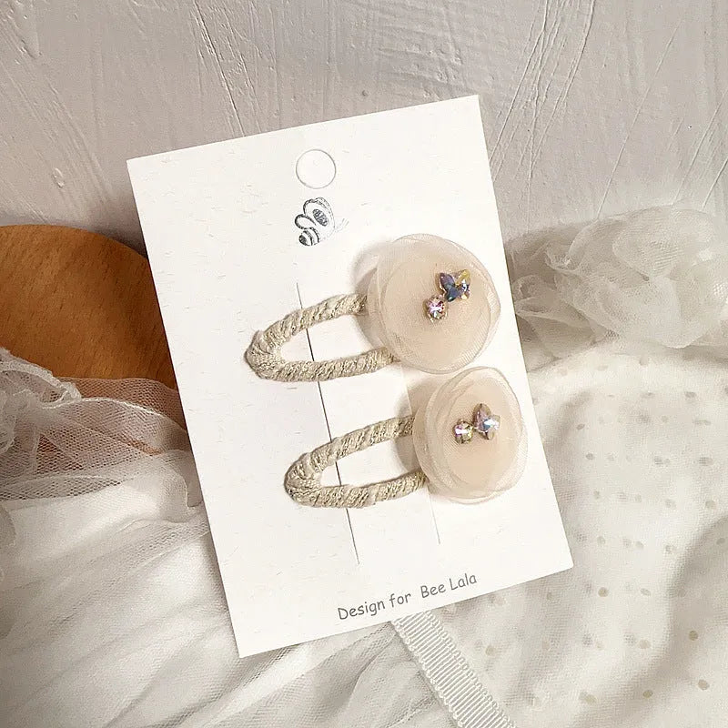 Children's press clip hair accessories set with cloth bows, sequins, pearls, and crystal flowers in pink and beige