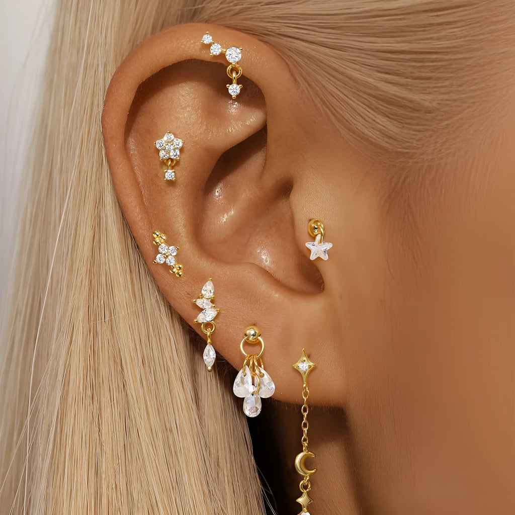 S925 sterling silver geometric star-shaped earrings with an embedded moon diamond, shown in a gold colour finish.