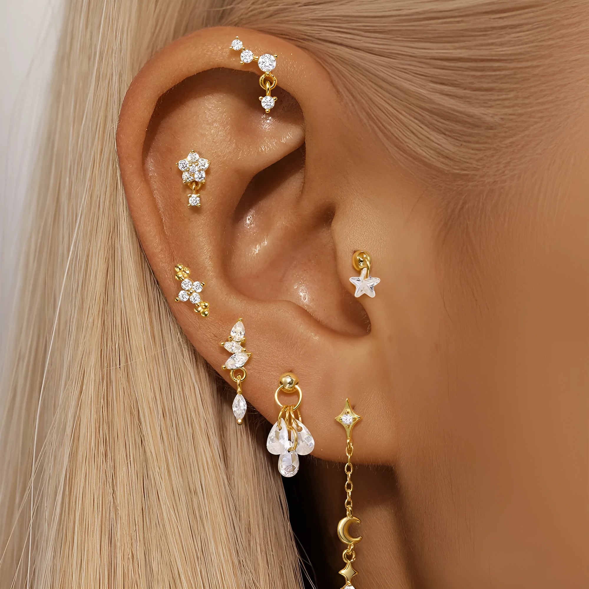 S925 sterling silver geometric star-shaped earrings with an embedded moon diamond, shown in a gold colour finish.