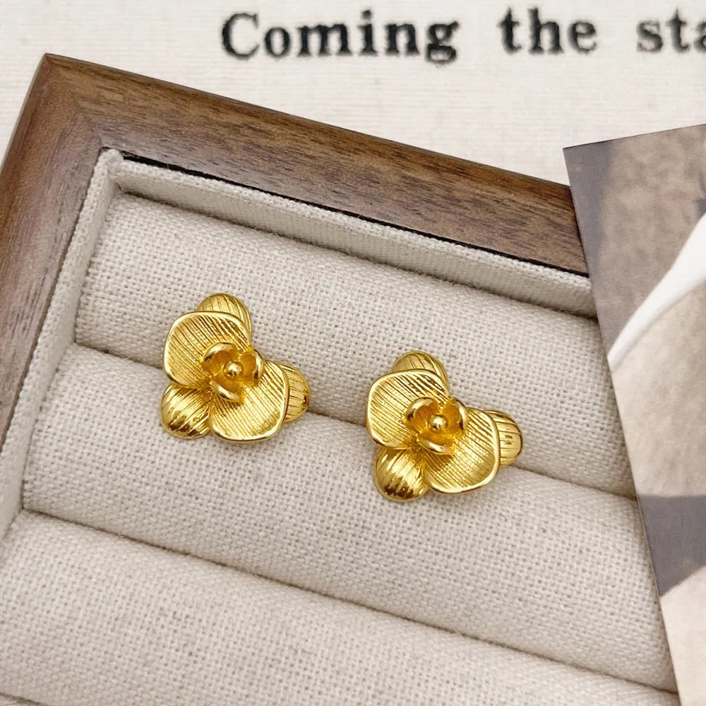 Retro flower earrings for women in gold and silver colours with petal detail