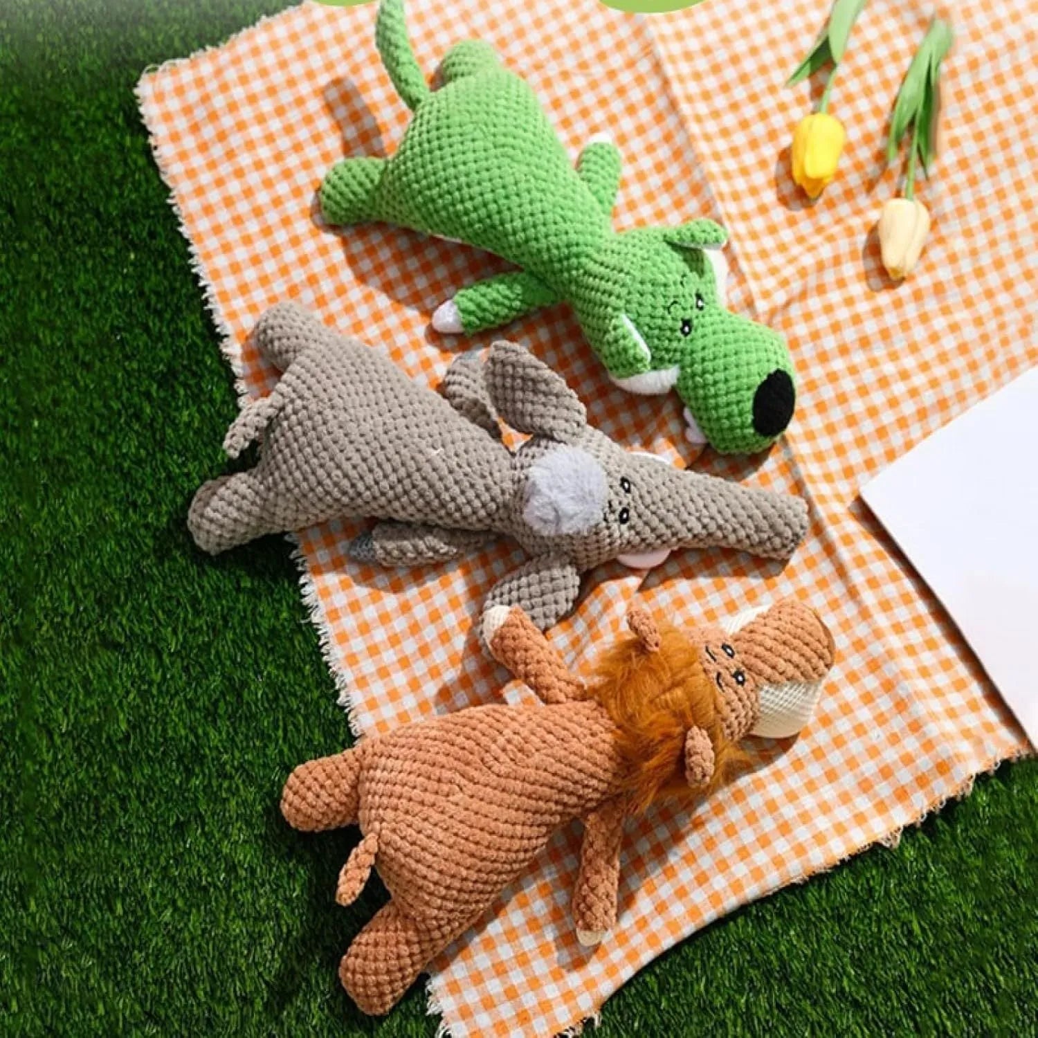 Colourful plush dog toy in animal shape with corn kernel texture and squeaker.