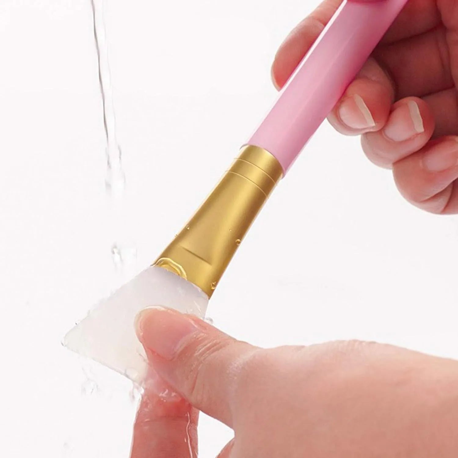 Reusable soft silicone spatula for applying face and body masks in various colours.