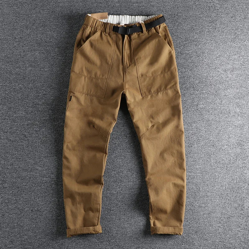 Men's khaki cotton work trousers with an adjustable N-I buckle belt on the waistband, shown with a 3D cut design.