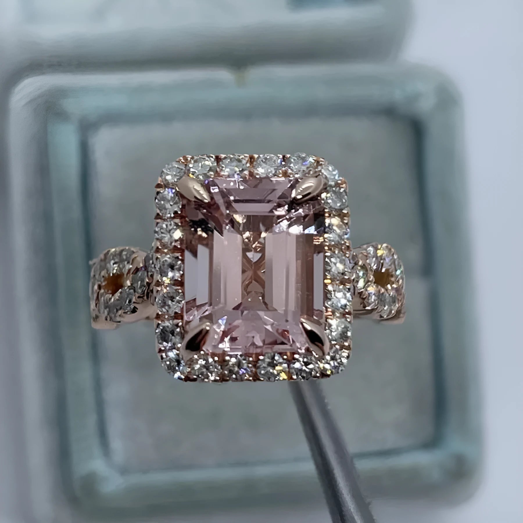 Rose gold electroplated alloy ring with geometric shape on white background