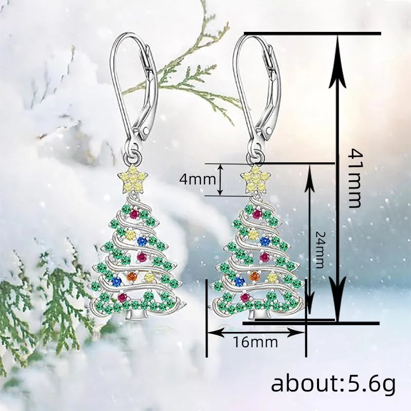 A pair of star-shaped Christmas tree earrings for women in a white gold colour.
