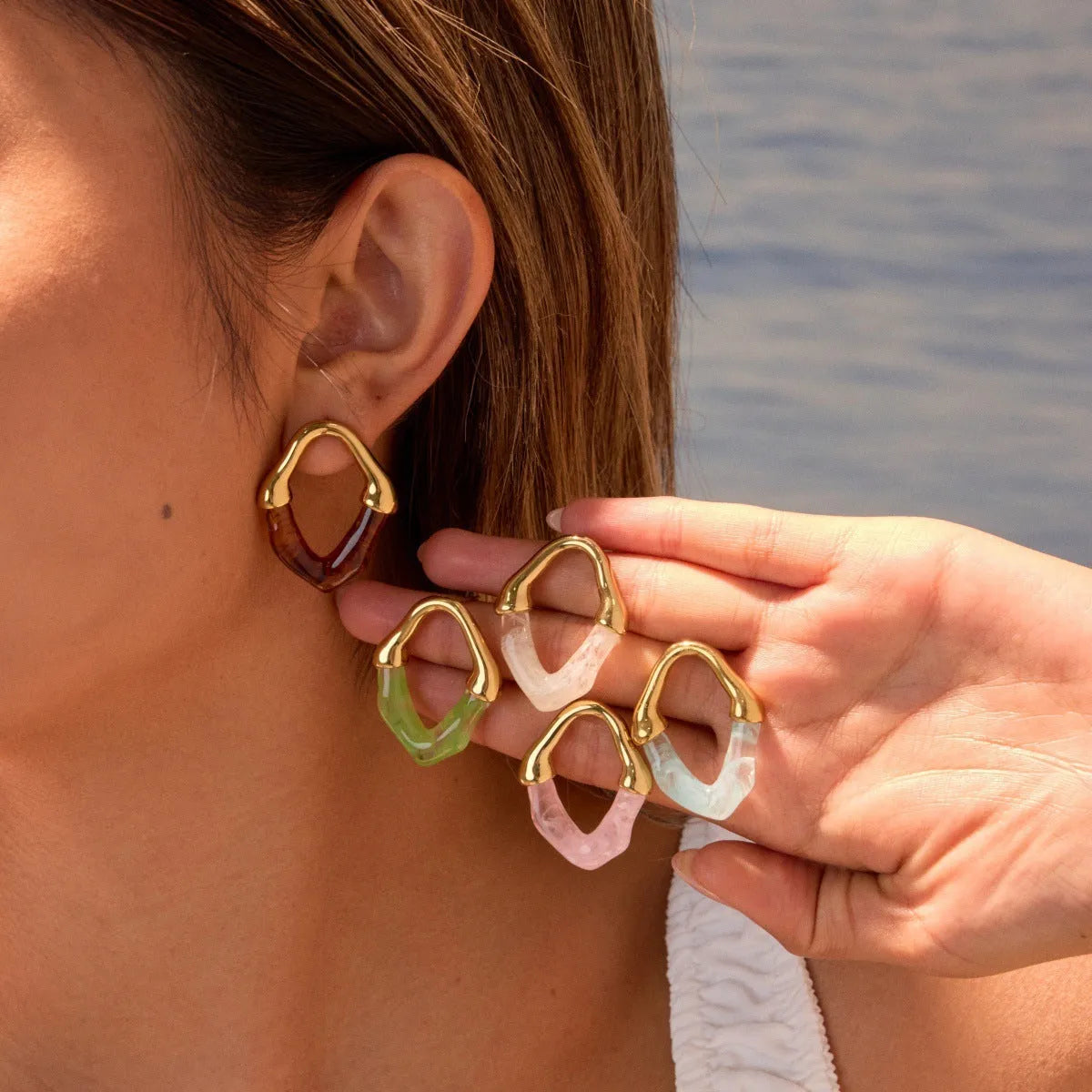 Stainless steel earrings with pink resin stitching and 18K gold plating