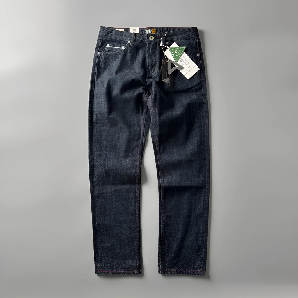 Men's primary colour straight leg denim jeans laid flat, showing mid waist and classic five-pocket design.