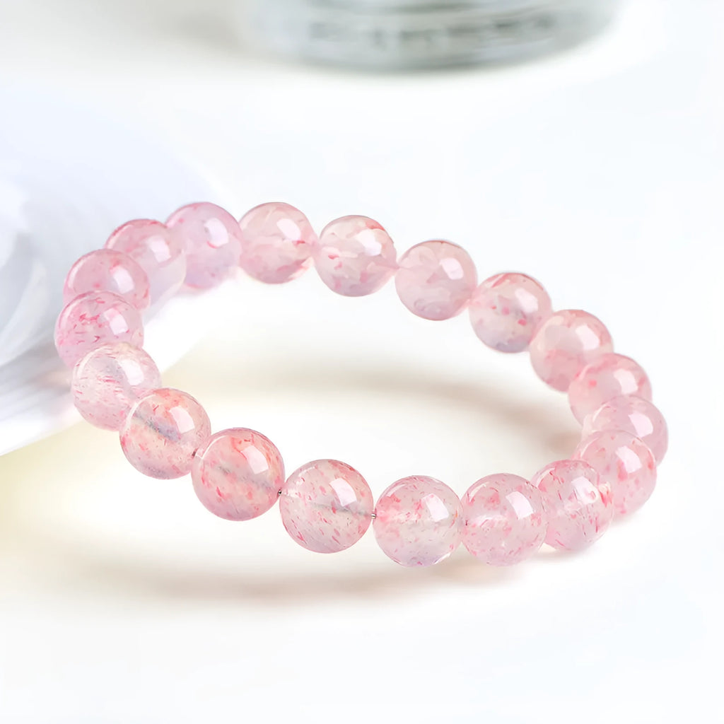 Natural white water strawberry quartz crystal bracelet with geometric beads.