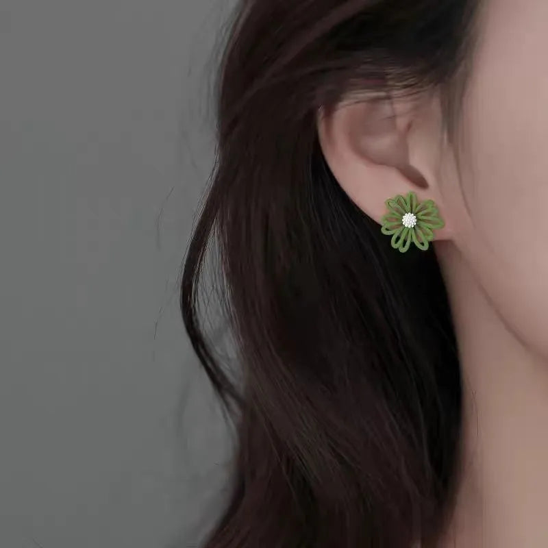 Alloy flower stud earrings in blue and orange, yellow and white, or white and green colour options