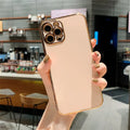 Gold plated iPhone case with vertical silicone stripes on a pink background, compatible with multiple iPhone models.