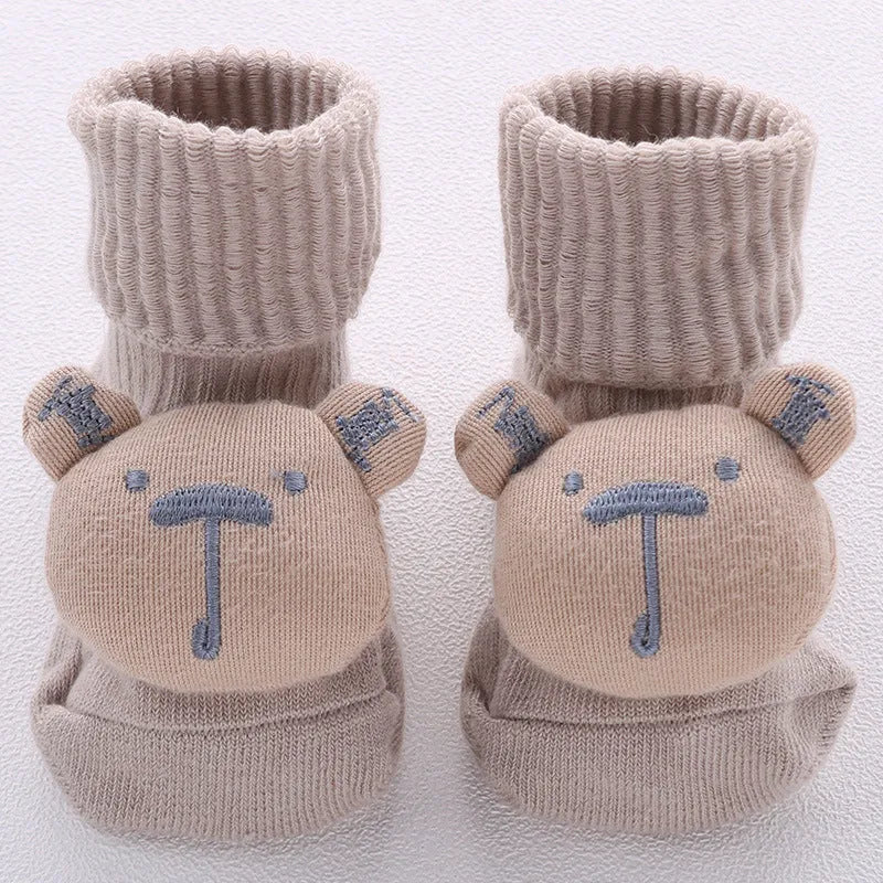 Cotton baby floor socks in various colours and patterns with size guide for ages 0-3 months