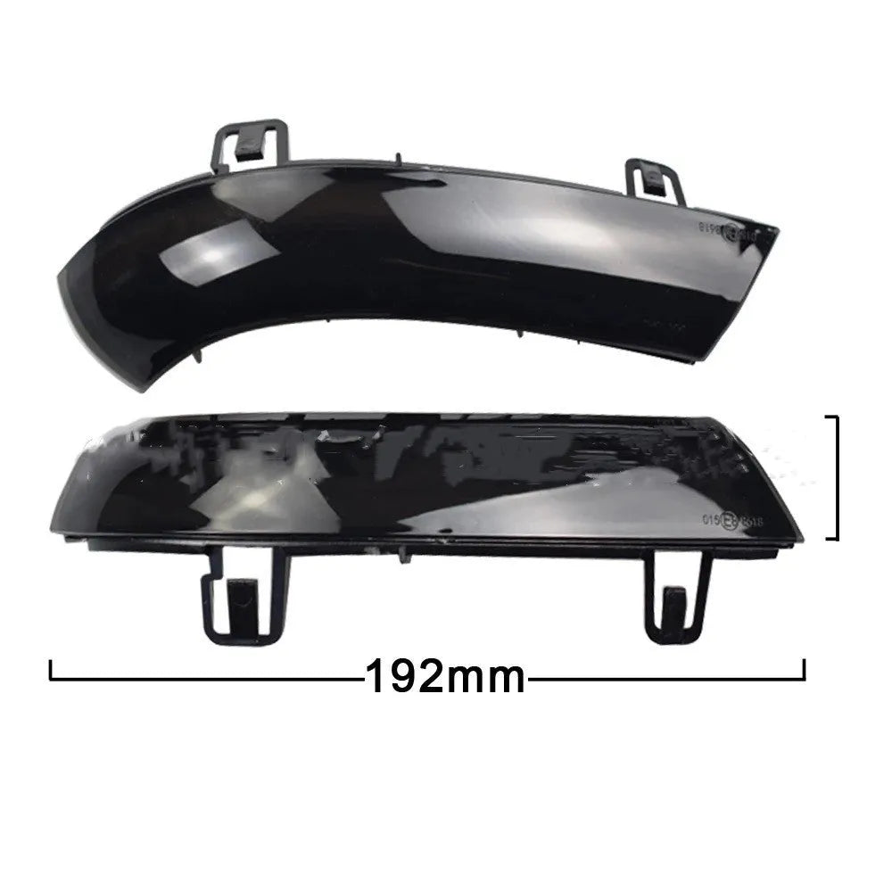 Volkswagen Golf MK5 front end with dynamic sequential amber and blue turn signal lights illuminated.