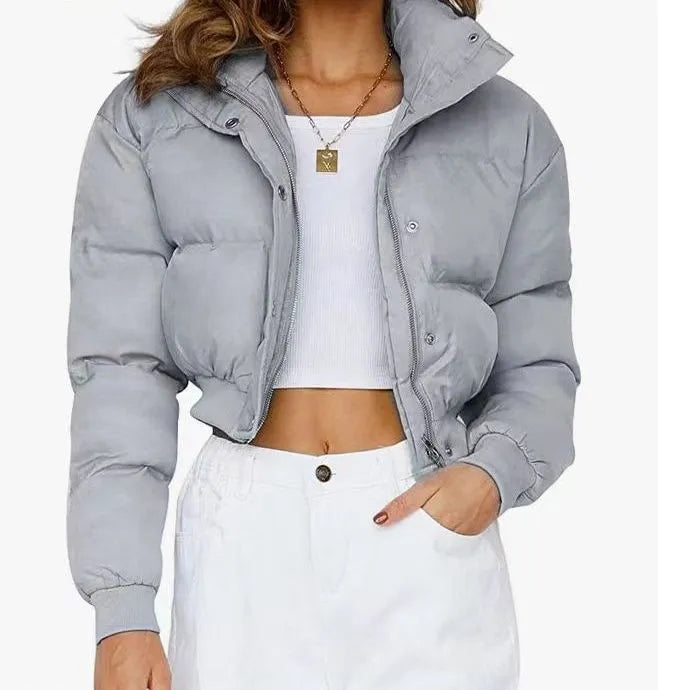 Women's loose-fit polyester jacket in blue, shown with long sleeves and a casual design.