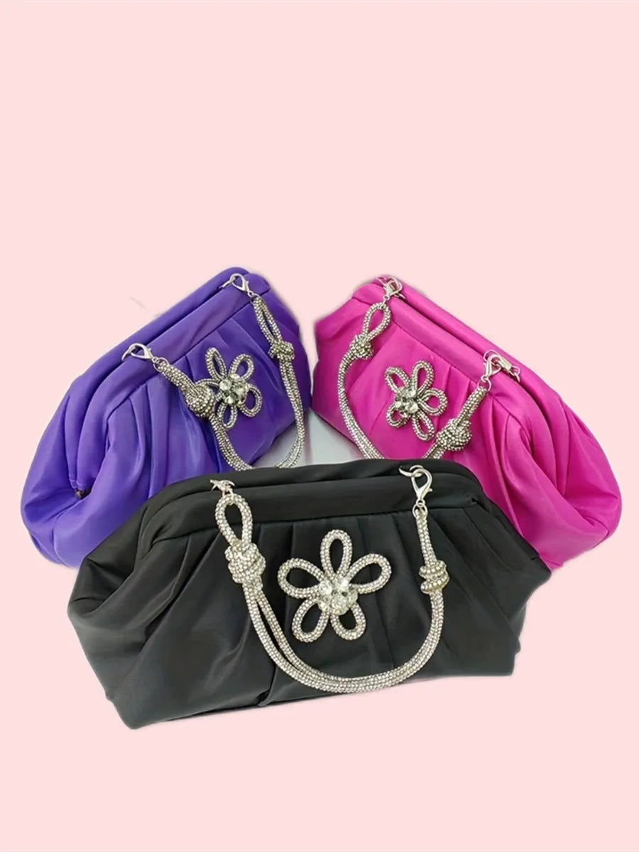 Soft lavender purple women's crossbody bag with chain details and a structured shell shape.