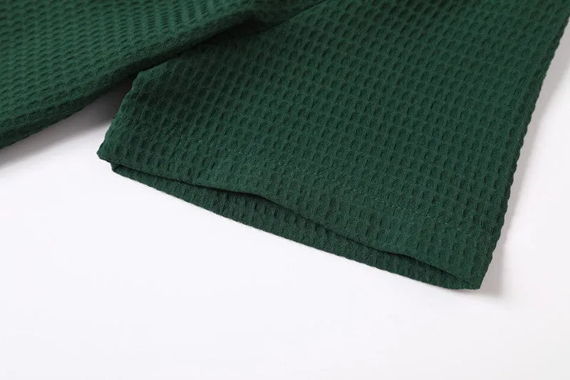 Retro waffle pattern dark green lapel Polo shirt with short sleeves and two metallic buttons