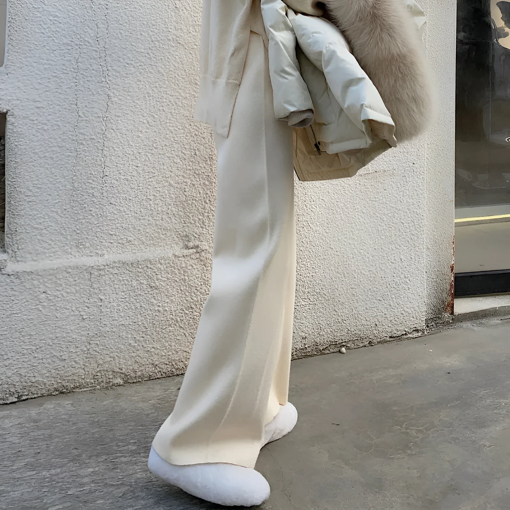 Women's high-waist knitted wide-leg trousers in a cream white colour, showcasing the straight-leg mopping style.