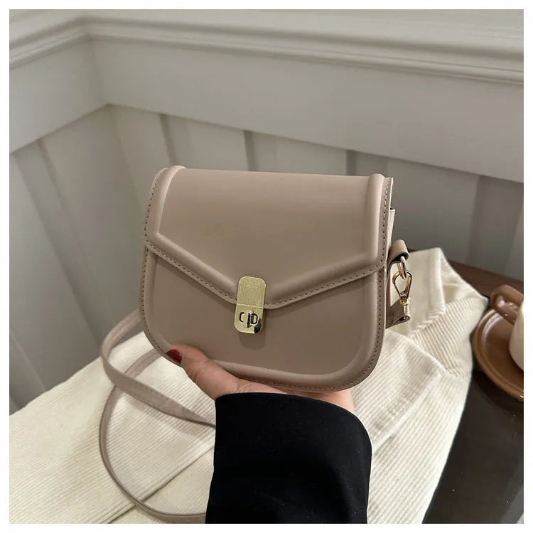 Soft PU leather clamshell messenger bag in horizontal square design shown in available colours.