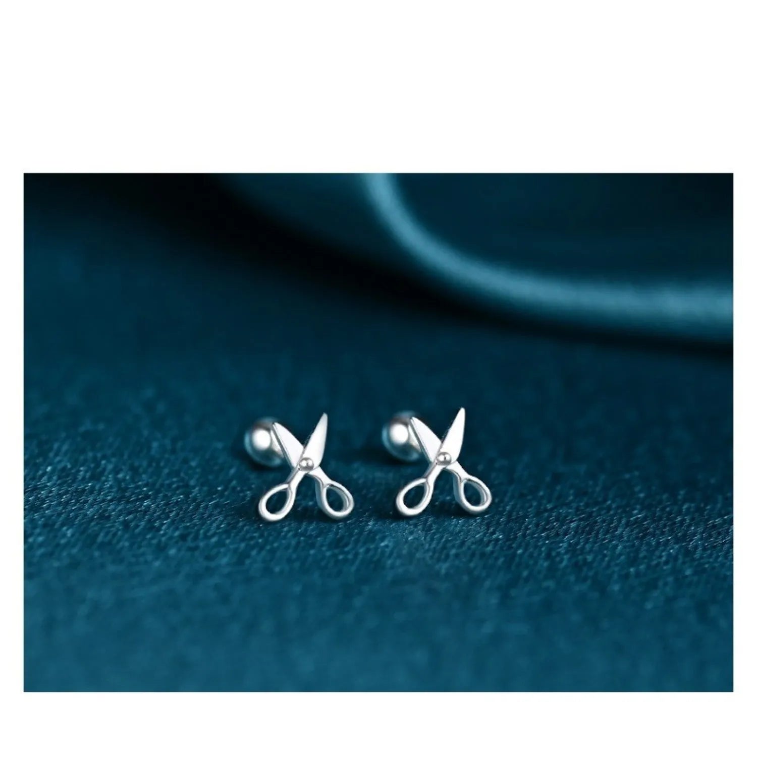 Small silver ear nails with miniature scissors design and screw-back fitting