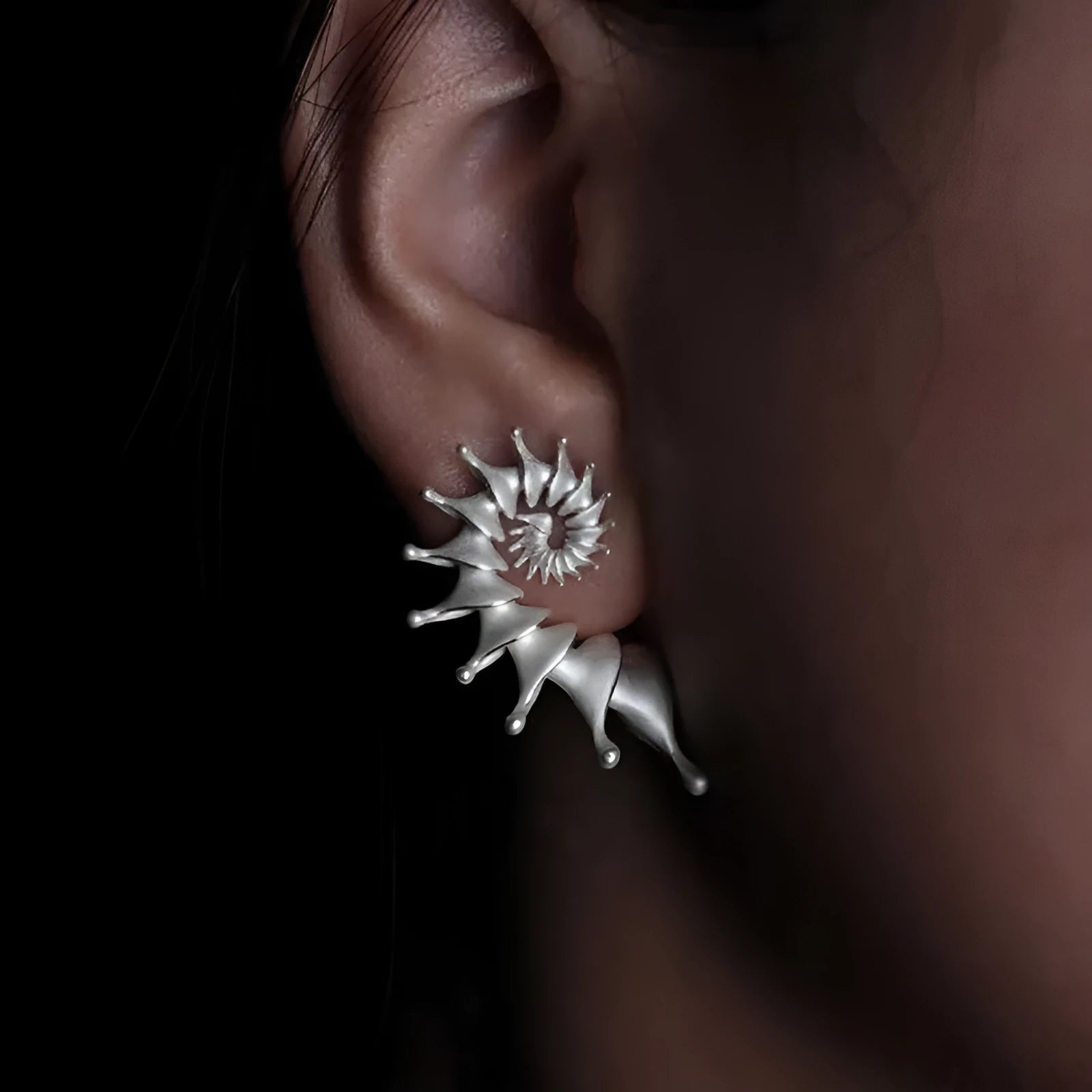 Conch colour stud earrings with three-dimensional matte finish and irregular contemporary design