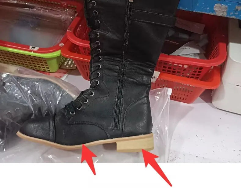Women's black knight ankle boots with a cross-strap design, made from artificial PU leather.