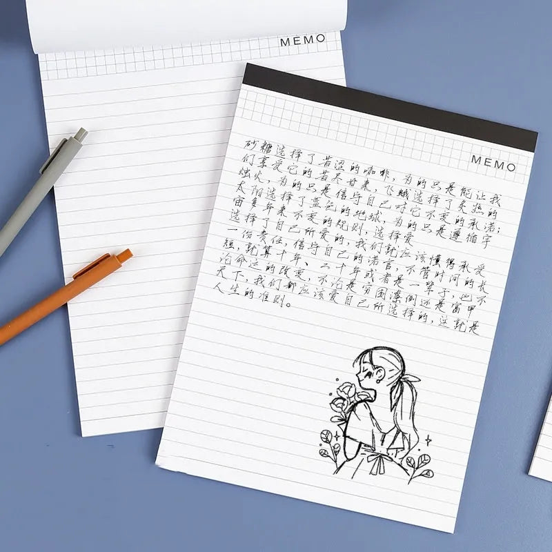 A4 tearable notebook with grid-lined ivory paper and a paper cover, showing wireless adhesive binding